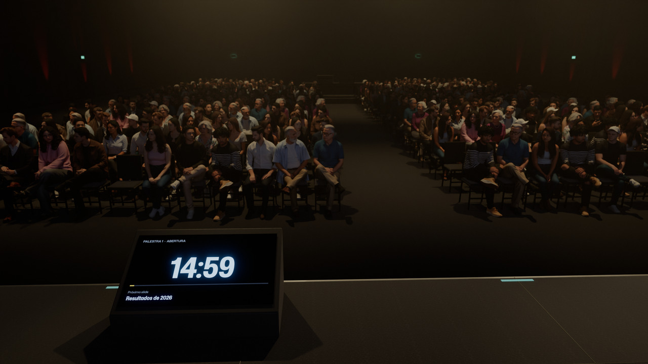 O palco visto por quem apresenta: o retorno com o cronômetro e o próximo slide, e a plateia esperando.